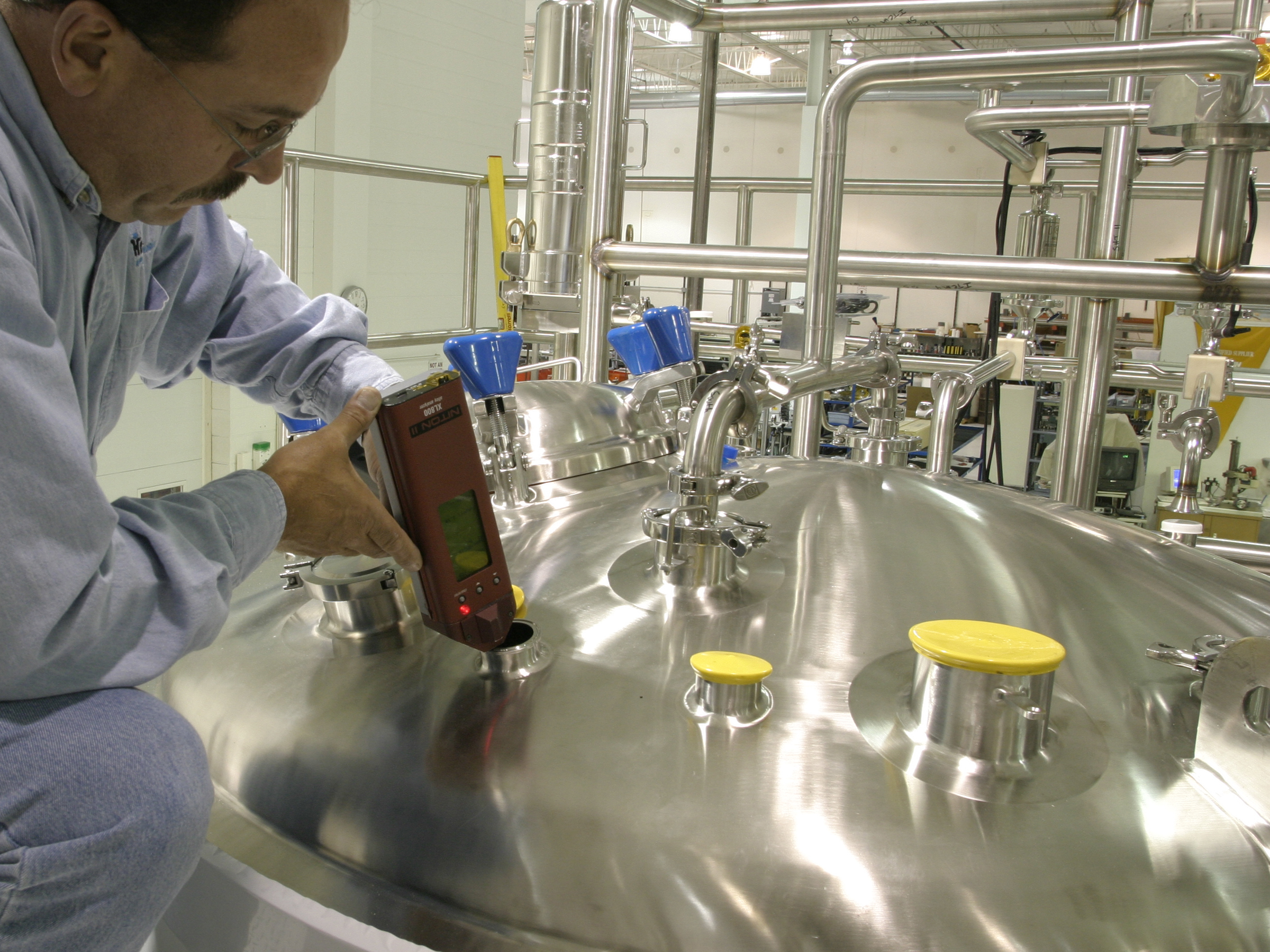 One of Our Quality Technician doing PMI on a Stainless Steel Vessel