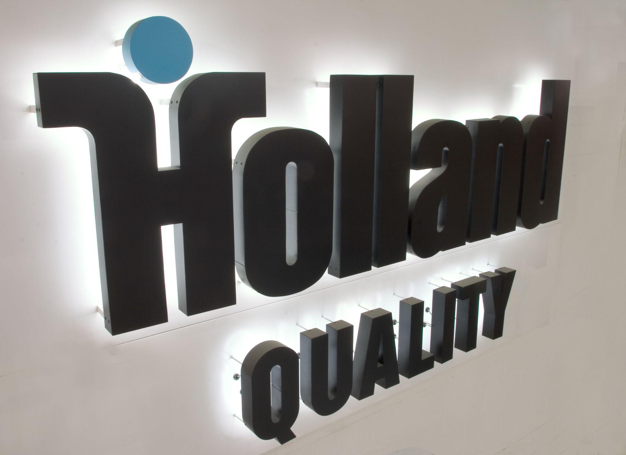 The Holland Quality sign on display inside HAT's Burr Ridge, IL fabrication shop